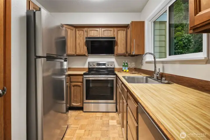 Newer stainless steel appliances and professional hood fan
