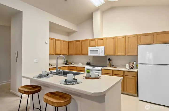 Kitchen features a classic working triangle for ease of cooking.