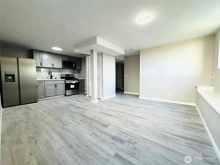 Lower level Living Room New Flooring and Brand New Kitchen