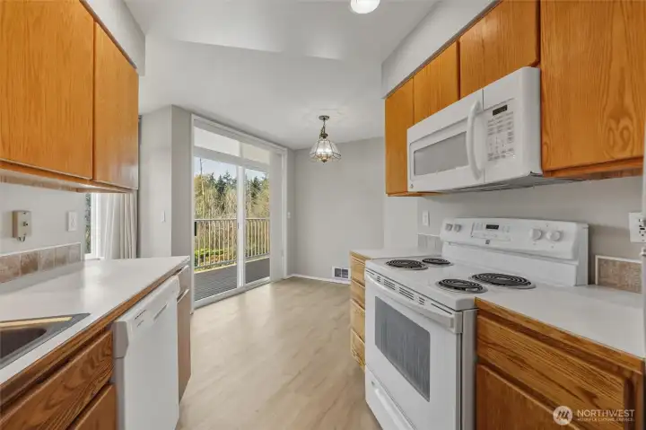 Kitchen with oak cabinets and dining space