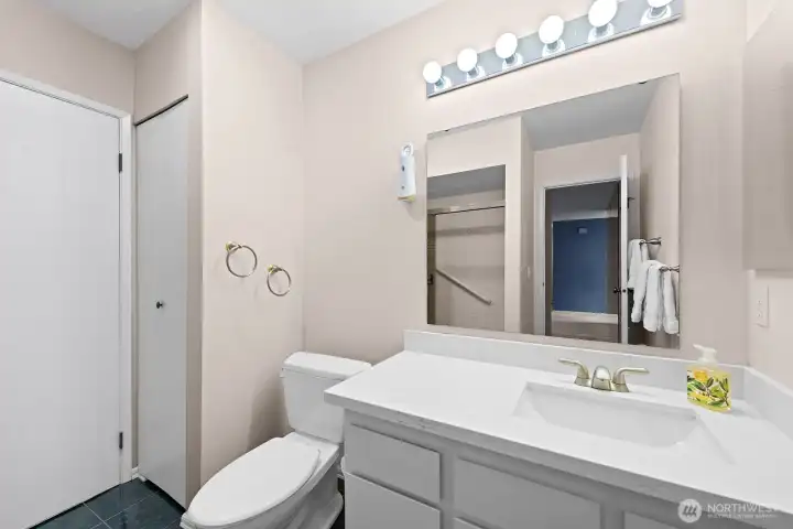 Hall bath continental with door to Primary