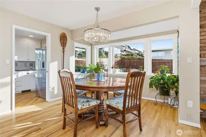 Formal dining area with alcove of windows over-looking back patio.