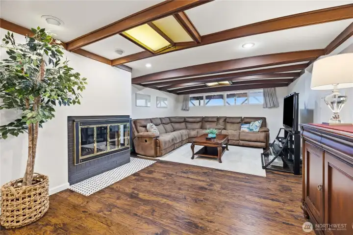 Nautical themed recreation room with fireplace.