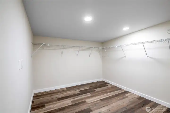 extremely large walk in closet in primary bedroom