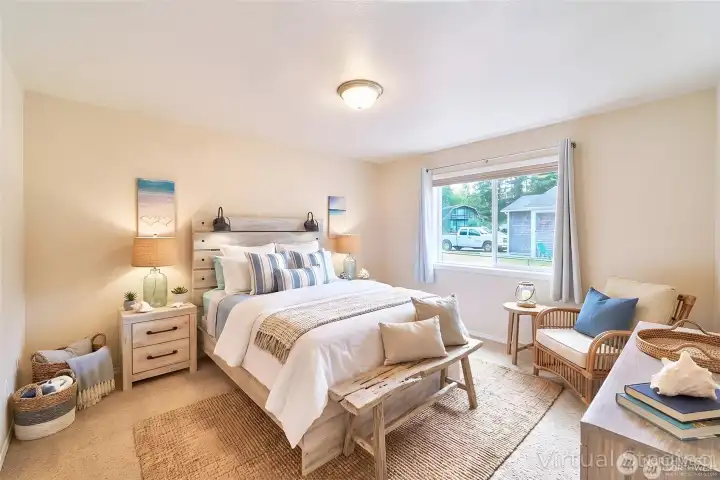 Bedroom 2 offers a warm and comfortable space with soft natural light and plenty of room for relaxing.
