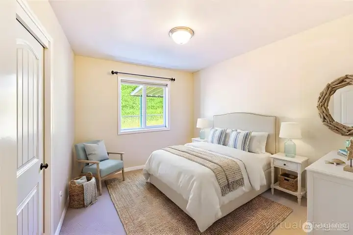 Bedroom 3 offers a bright and comfortable space with a peaceful view out the window.