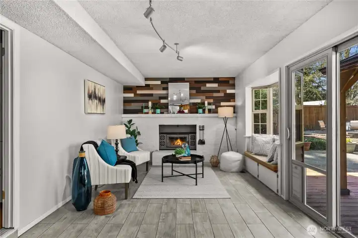 Family room with cozy fireplace + slider to backyard!