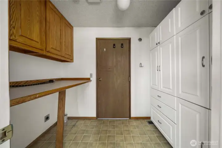 Mudroom / laundry area with tons of storage space.