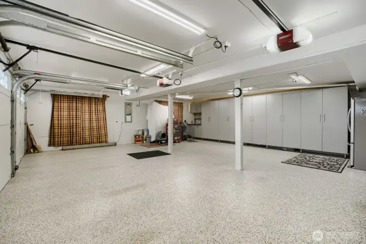 3 car garage custom cabinetry and new floor