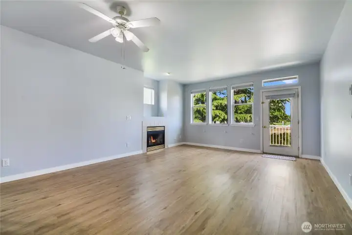 This Great room has a lovely view, cozy gas fireplace and lots of natural lighting.