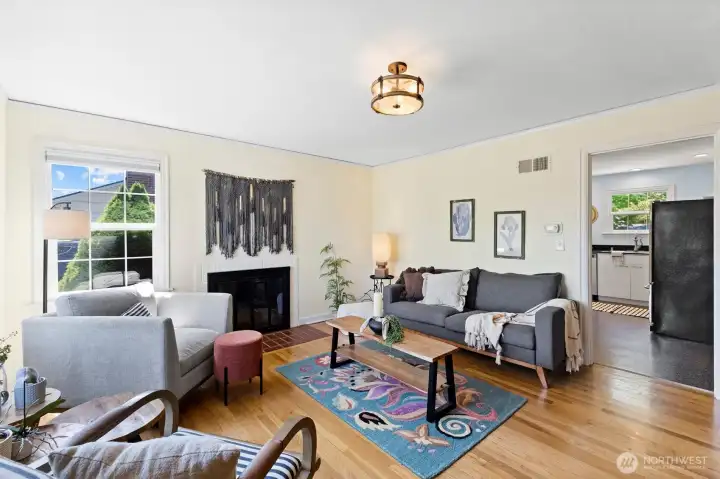 Main level living area filled with natural light and easy flow into the kitchen.