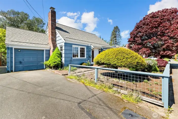 Attractive curb appeal with classic styling, updated exterior colors, and beautifully maintained landscaping.