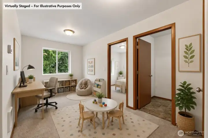 At the top of the stairs you will find the loft area, staged here as if it were an office and playroom. Peek of the first guest room through the left door, and laundry room through the right one.