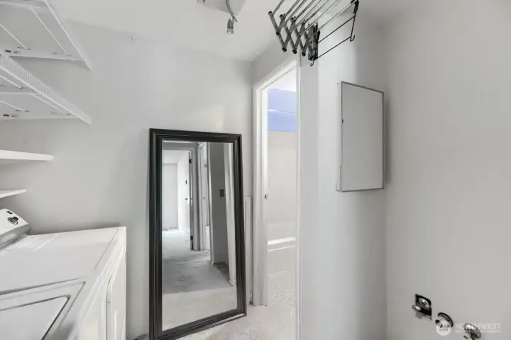 Laundry downstairs next to bedrooms.