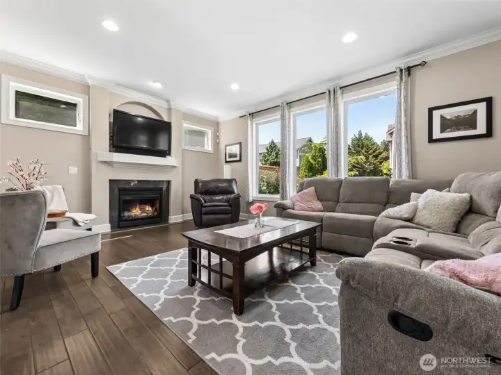 Living Room with gas fireplace and plenty of natural light