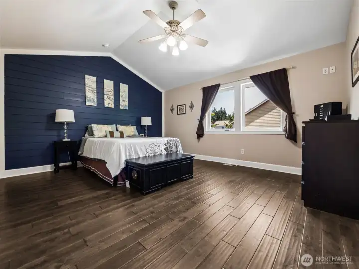 Spacious Primary Bedroom with vaulted ceiling, walk-in closet and 5-piece en-suite