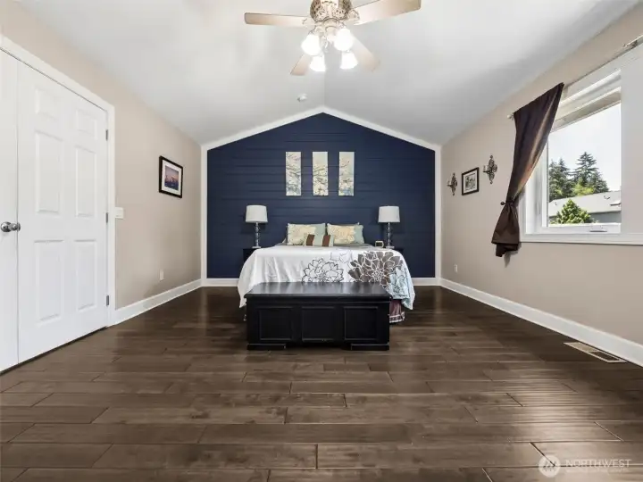 Spacious Primary Bedroom with vaulted ceiling, walk-in closet and 5-piece en-suite