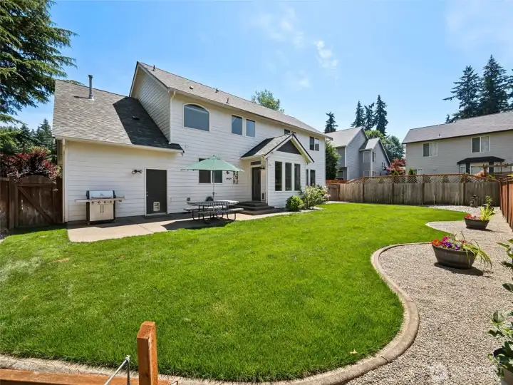 Fully-fenced Backyard with patio, garden area, and room for activities!