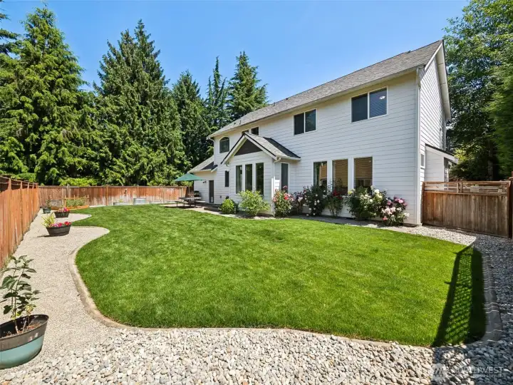 Fully-fenced Backyard with patio, garden area, and room for activities!
