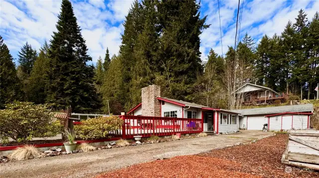 East side of home with garage and shed