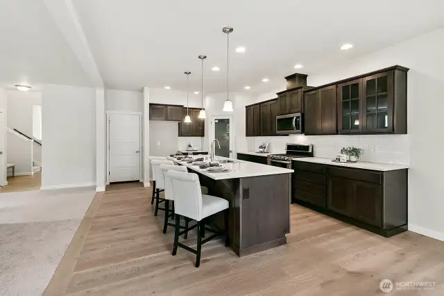 Home is under construction. Photos are of a previously built home from the same community with similar finishes that are staged. Builder reserves the right to change features, plans, prices & specifications without notice. Features vary by plan. Buyer to verify square footage.