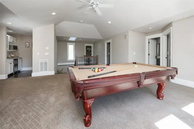 Pool table area includes a kitchenette.