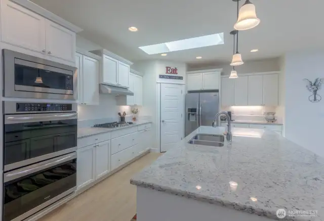 Open Kitchen -Double Ovens, natural gas cooktop, SS Appliances and a Pantry