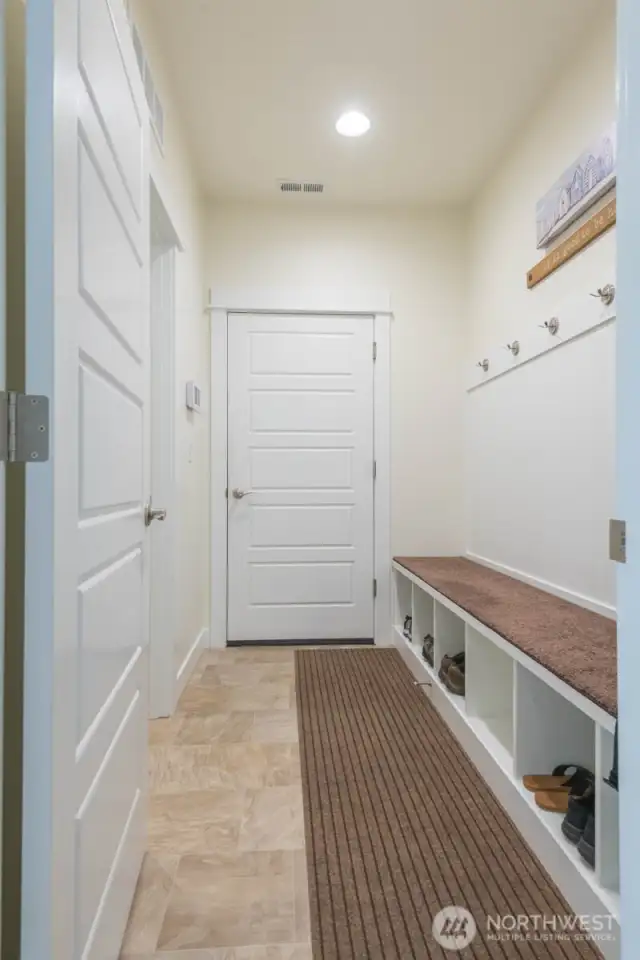 Mudroom through to Garage, Washer & Dry are in their own room to the left