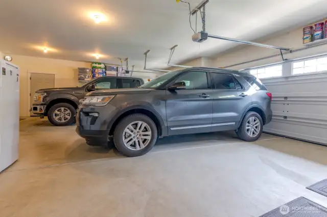 Oversize 3 Car Garage that has an extra long bay that fits some full size trucks
