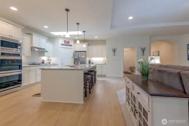 Open Kitchen -Double Ovens, natural gas cooktop, SS Appliances and a Pantry