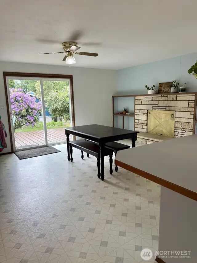 Large Dining Room with working fireplace with cover to protect the kiddos and pets