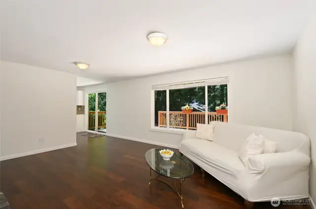 Lovely backyard scenery spans the living spaces.