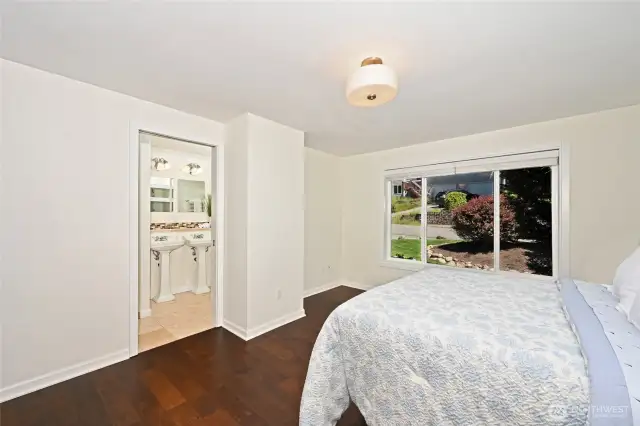 Retreat your upgraded primary suite with its renovated full bath & walk-in closet.