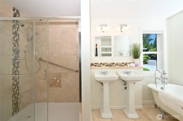 Stylishly remodeled 5-piece primary bath.