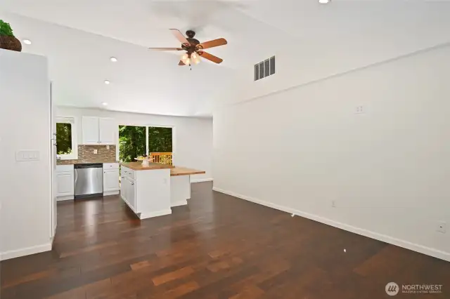 Expansive gathering spaces flow around the kitchen in the open concept layout.