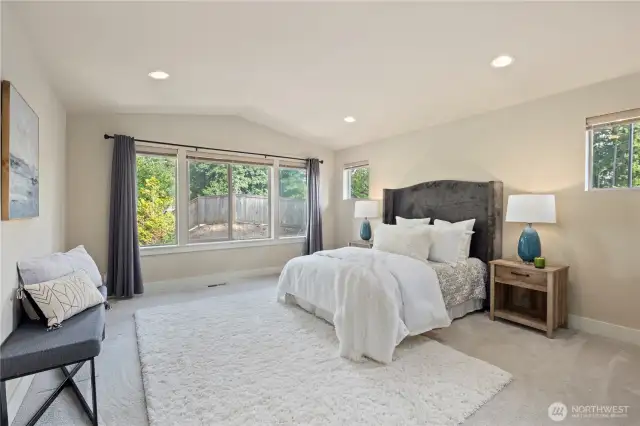 Enormous primary suite with a walk-in closet and 5-piece bathroom