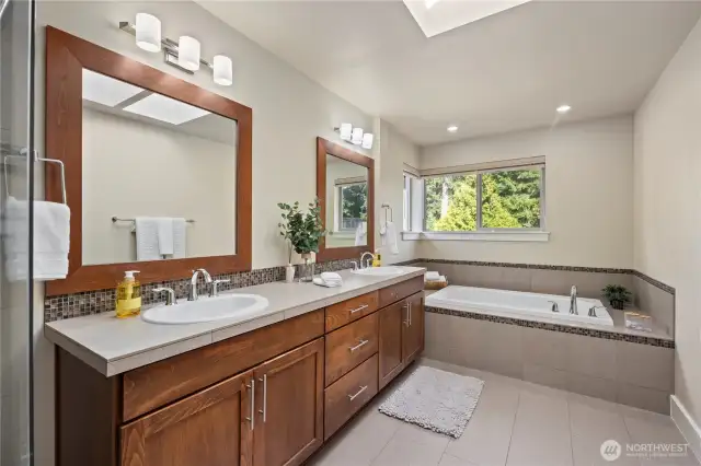 Primary suite with soaking tub, shower, and dedicated room for the toilet