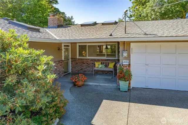Sweet sitting porch with both single step and sloped walkup.