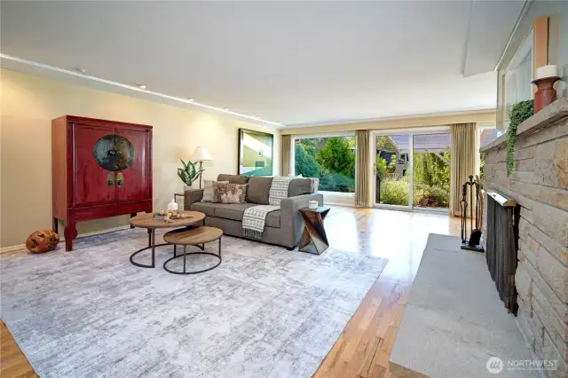 Hardwood floors flow through the main spaces, complemented by two fireplaces. Great open spaces for entertaining.