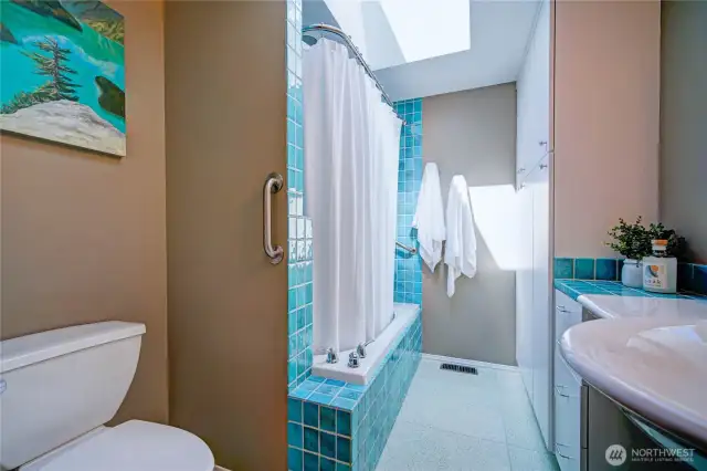 Fully remodeled bathroom with skylight, tons of storage, soaking tub and tile work.