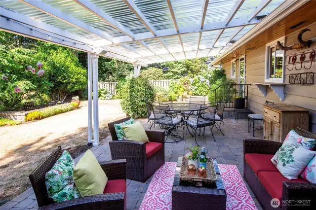 The backyard is retreat-like. Lush gardens and large covered patio extends the living space.