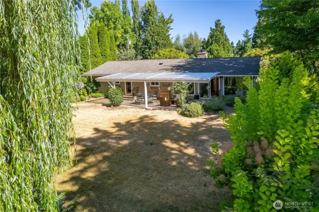 Large grassy yard and mature landscape offer tons of privacy!