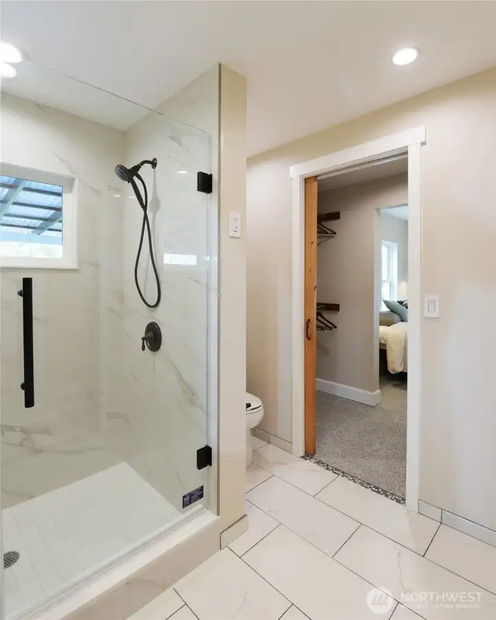 Shower into closet connecting to main bedroom