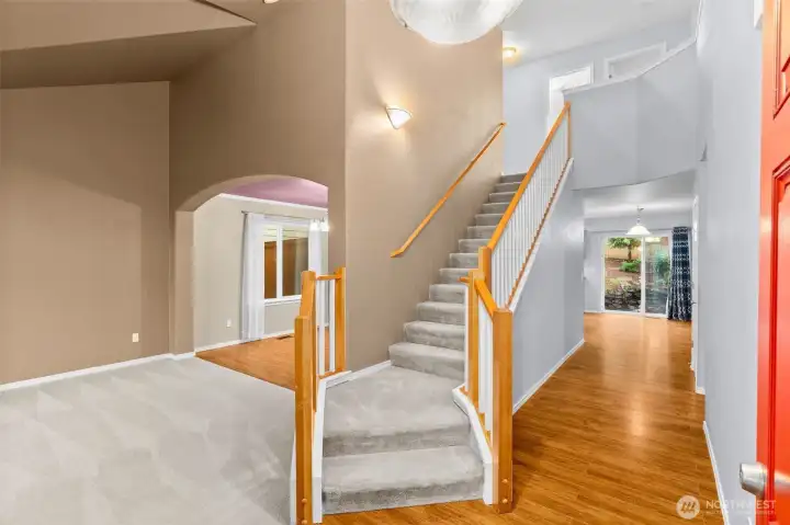 Warm hardwood floor greet you. Vaulted ceilings lend light and airiness to the home