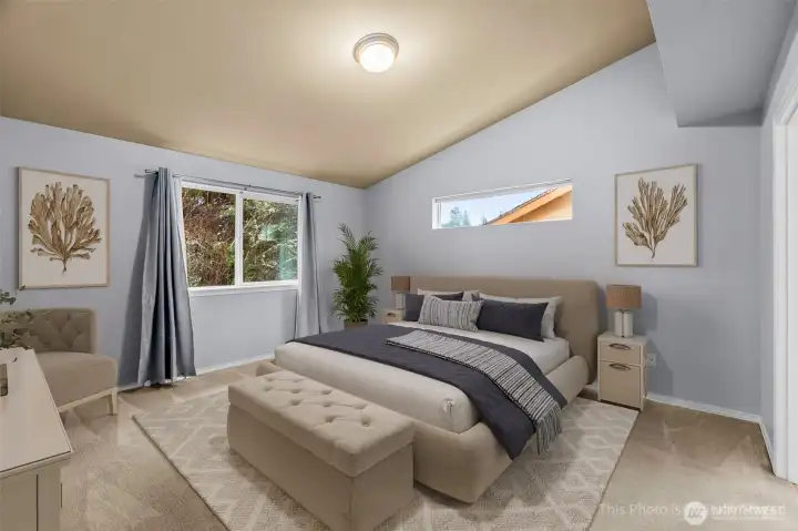 The primary bedroom is spacious and has a nice vaulted ceiling and plenty of space, plus a walk in closet and five piece ensuite bath