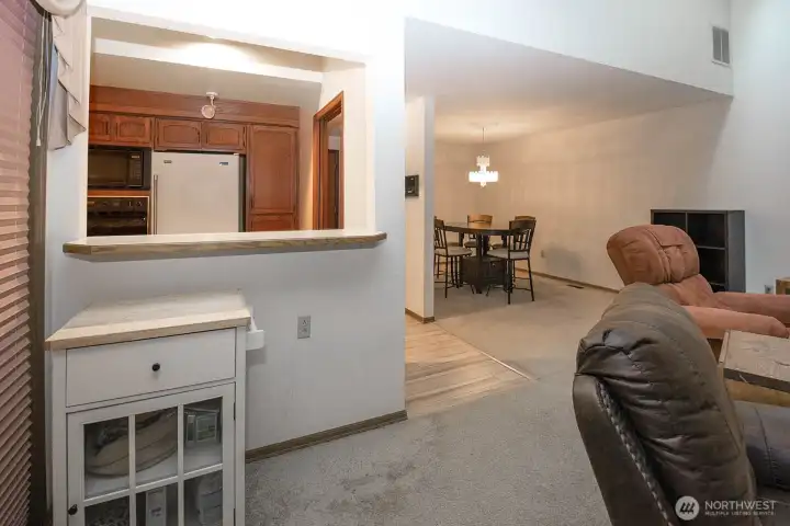 view to kitchen from LR. Slider to the deck is on the left