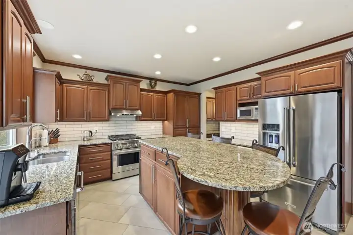 Stainless steel appliances and gas countertops.