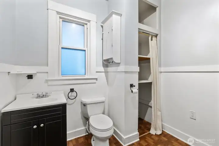 Bathroom with built-in shelving