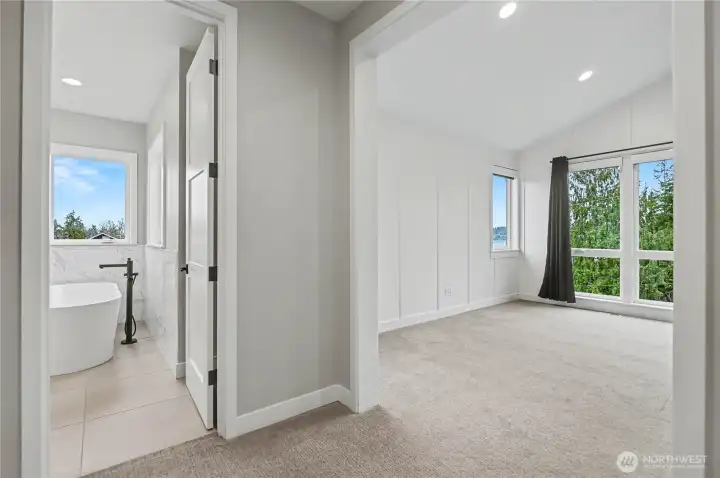 Another perspective of the primary suite highlights its thoughtful, functional layout and spacious design.