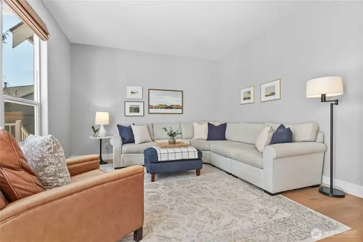 Living room right off kitchen overlooking the backyard